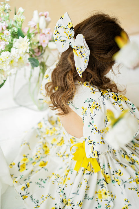 Amarélle Children's cotton dress with floral pattern and yellow ribbon