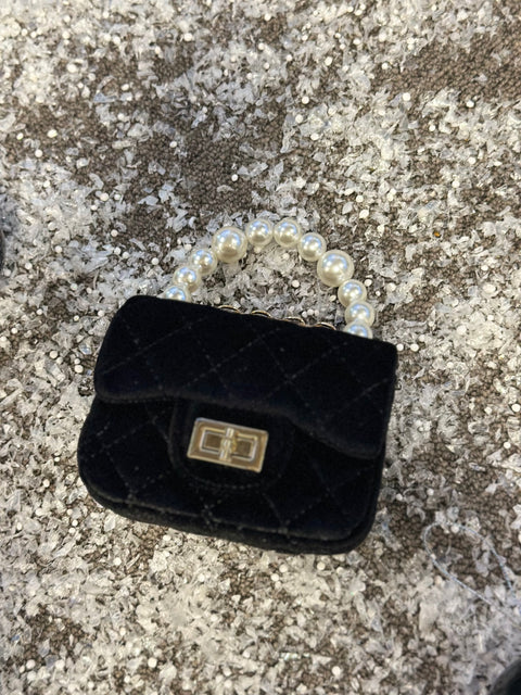 Mini Pearl in black bag  